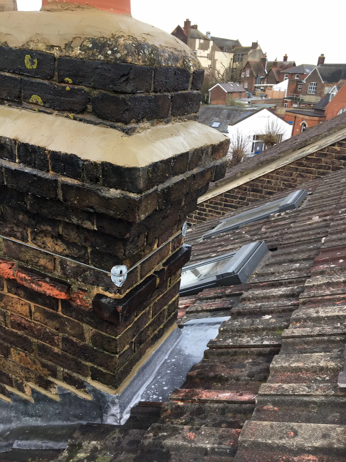 A chimney stack with the pots bedded into fresh flaunching